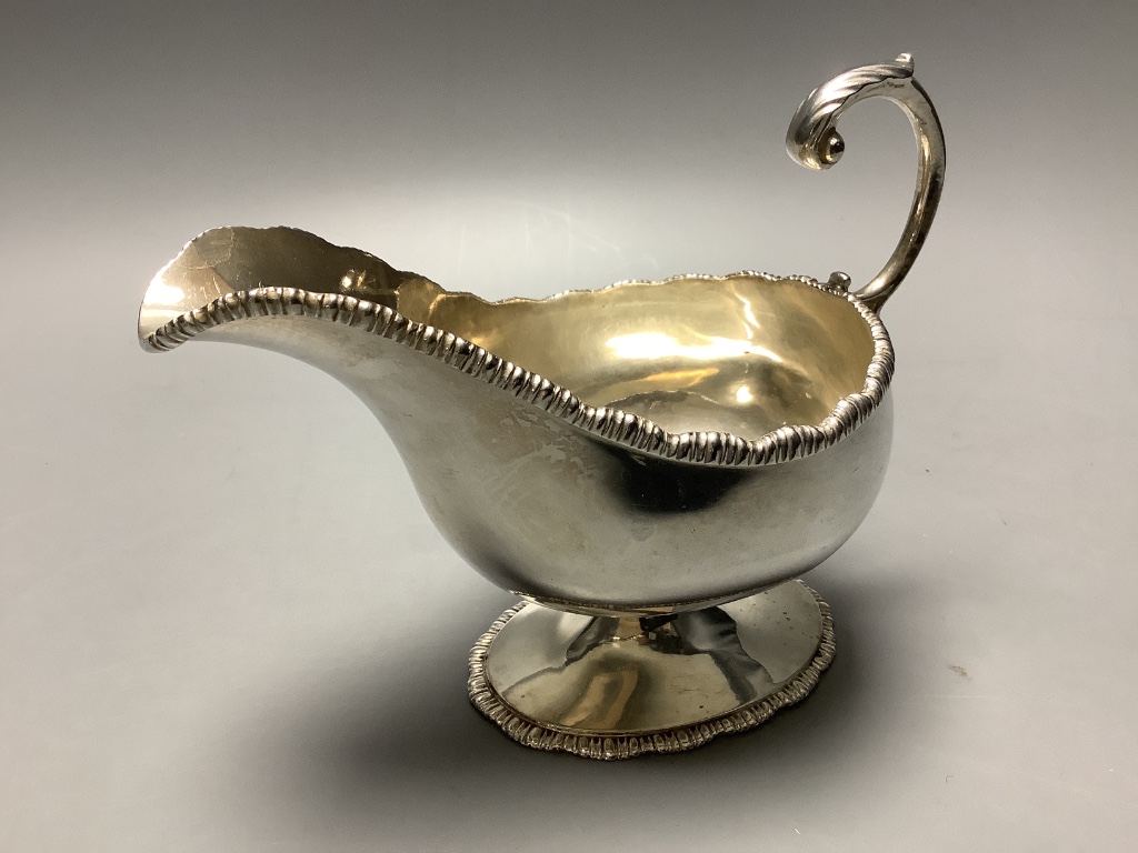 A late Victorian demi fluted silver sugar bowl & a sauceboat.